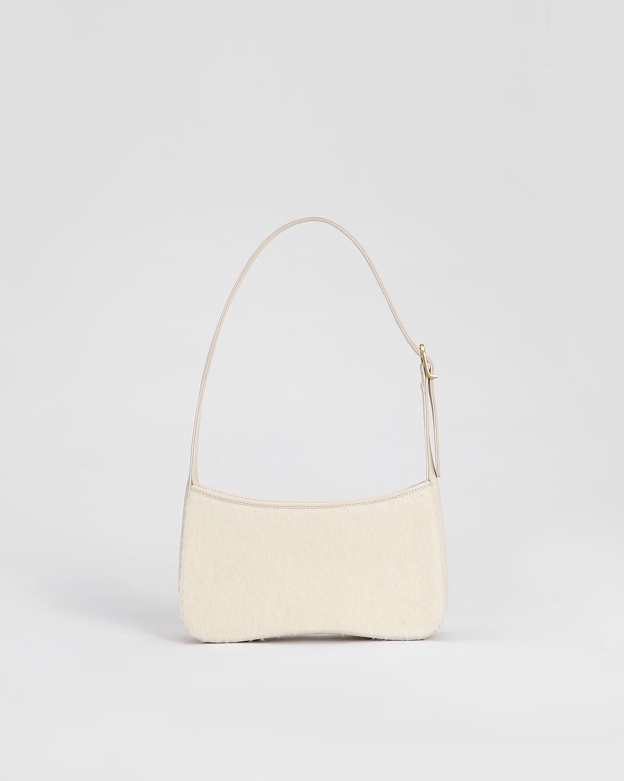 Camile Schoudertas in Alpaca wol en leder